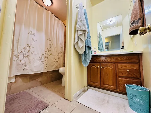 a bedroom with a bed and a mirror