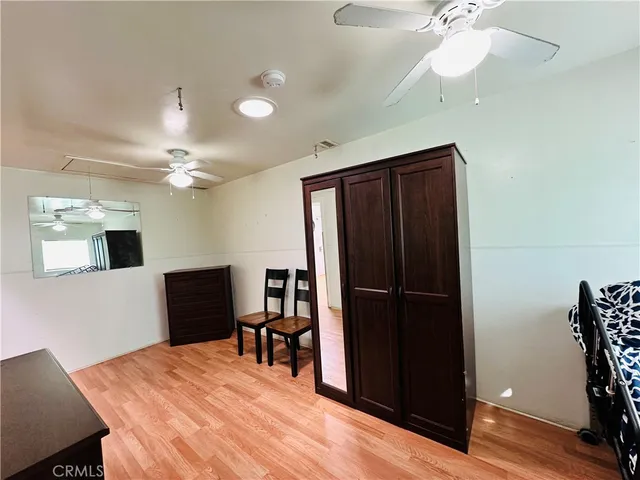 a view of a livingroom with furniture and wooden floor