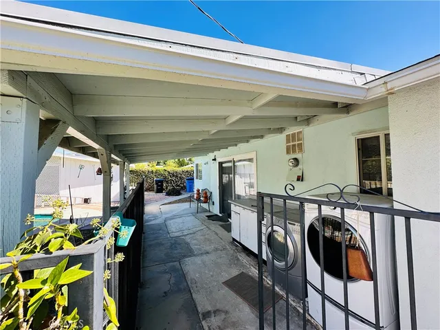a view of balcony with potted plants