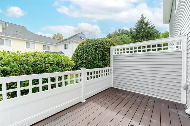 a view of a roof with wooden deck