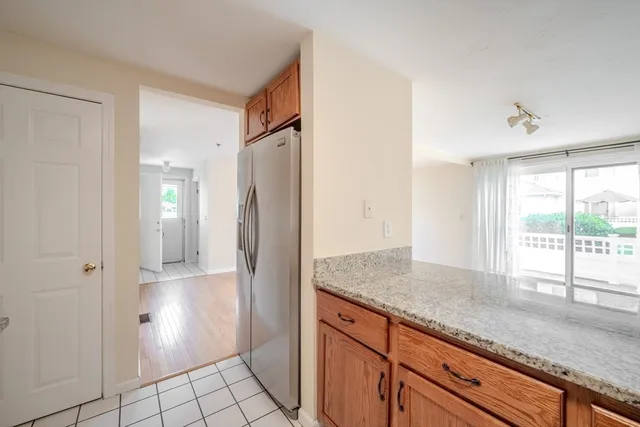 a hallway with sink and mirror