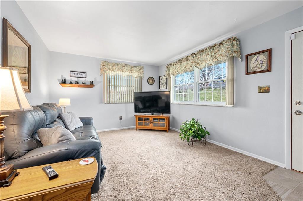 125 Lovi Road Baden, PA 15005 - Photo 12 of 25 a living room with furniture and a flat screen tv