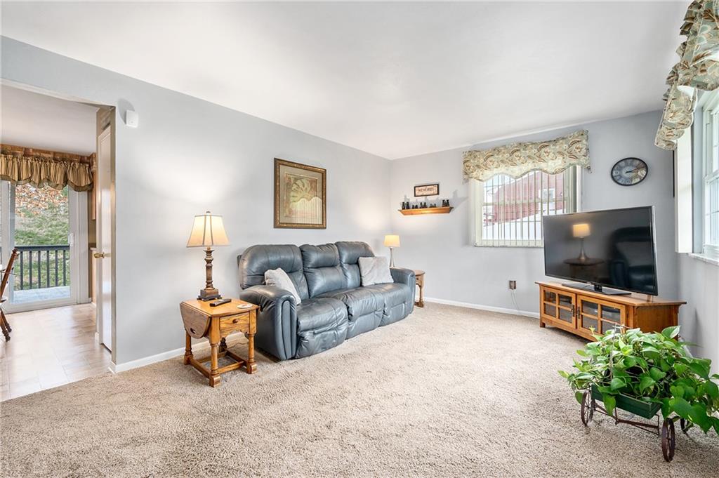 125 Lovi Road Baden, PA 15005 - Photo 3 of 25 a living room with furniture and a flat screen tv