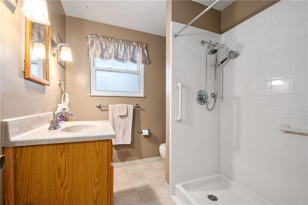 125 Lovi Road Baden, PA 15005 - Photo 10 of 25 a bathroom with a sink a toilet and shower