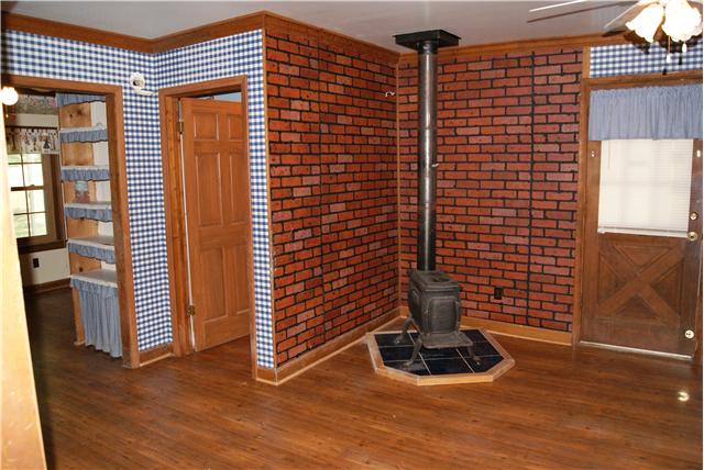 460 South Ray Road Portland, TN 37148 - Photo 5 of 20 A cozy wood stove sits in the corner of the kitchen.