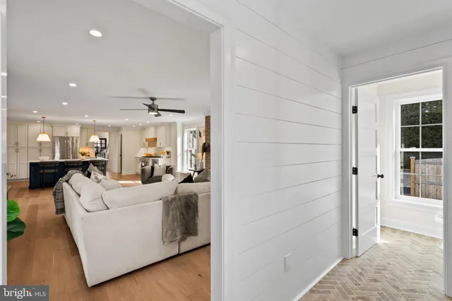 a kitchen with white cabinets and a sink
