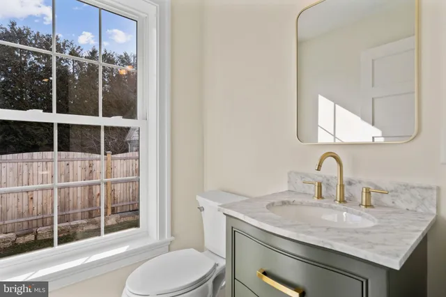 a bedroom with a bed and a view of kitchen