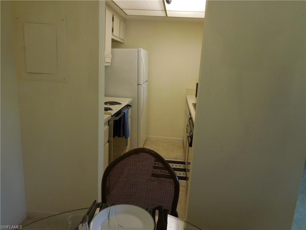 4287 27th Court Southwest, Unit 202 Naples, FL 34116 - Photo 17 of 22 a bathroom with a sink and mirror