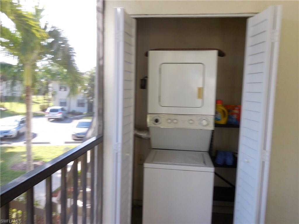 4287 27th Court Southwest, Unit 202 Naples, FL 34116 - Photo 21 of 22 a view of washer and dryer