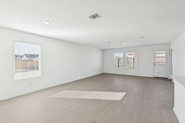 an empty room with windows