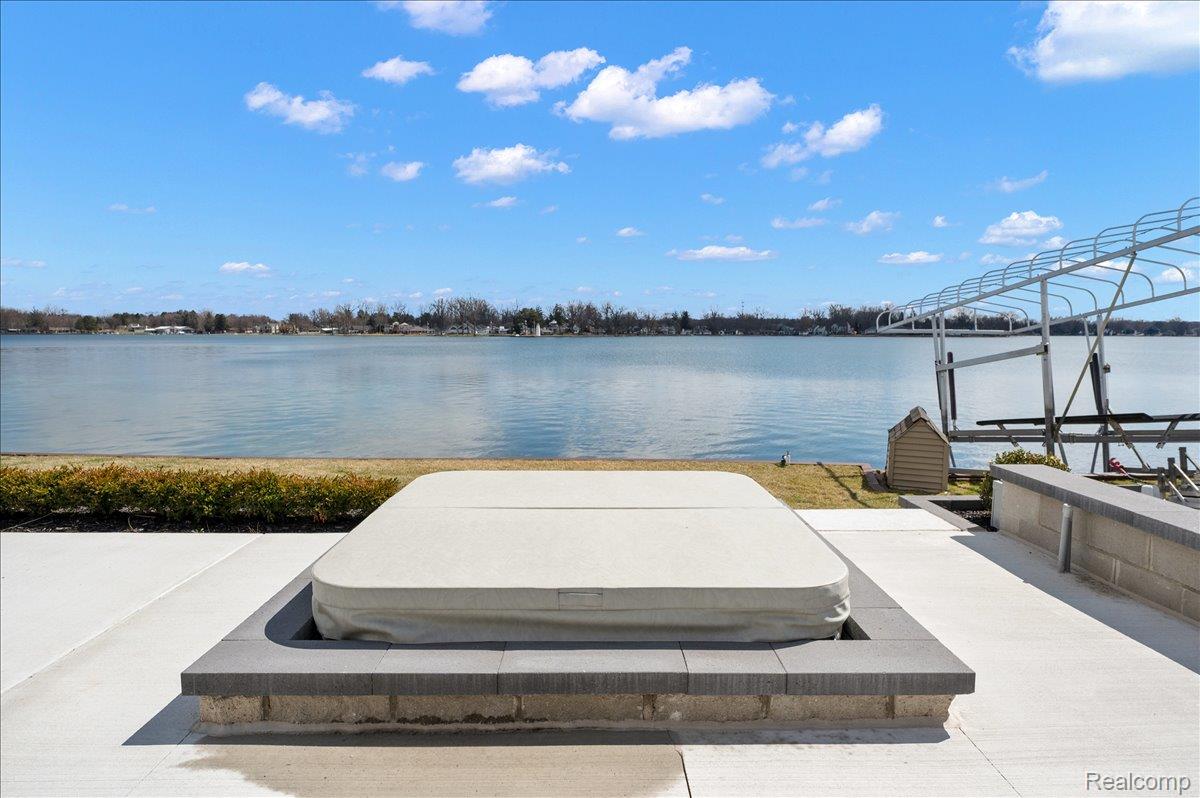 13459 Haddon Street Fenton, MI 48430 - Photo 67 of 84 View of patio featuring a dock, a water view, and boat lift