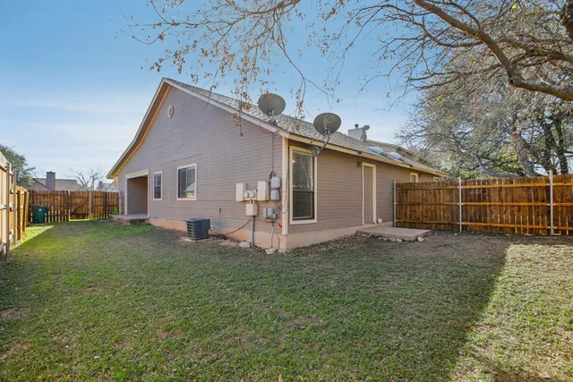 a view of a backyard with a house