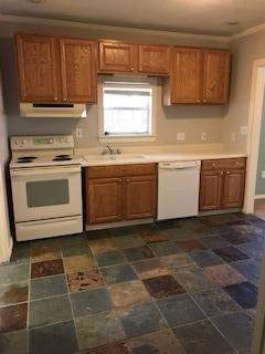 2425 25th Street Lubbock, TX 79411 - Photo 5 of 13 a kitchen with a stove a sink and a refrigerator