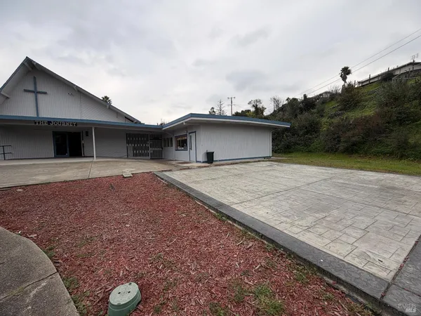 a house view with a backyard space