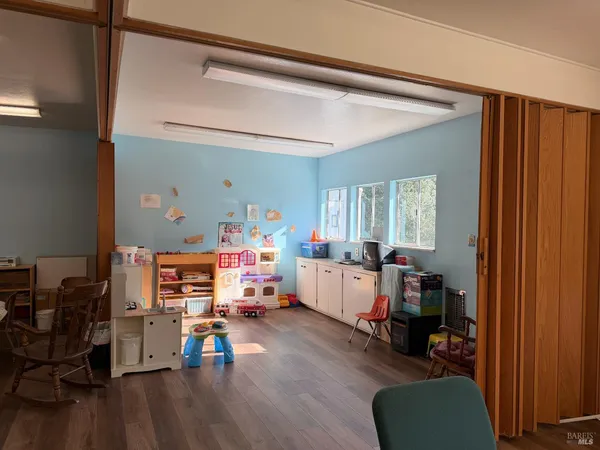 a view of a chairs and table in a room