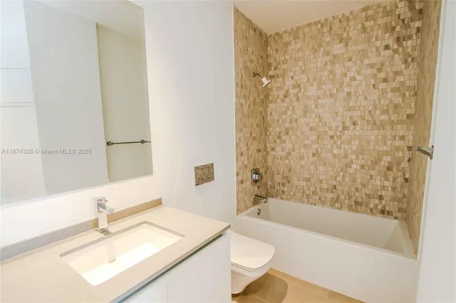 a spacious bathroom with a large tub and shower