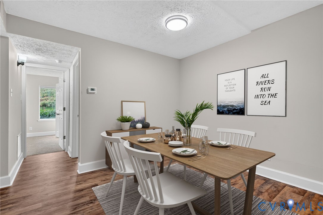 1501 Bronwyn Road, Unit 101 Henrico, VA 23238 - Photo 15 of 24 a view of a dining room with furniture and wooden floor