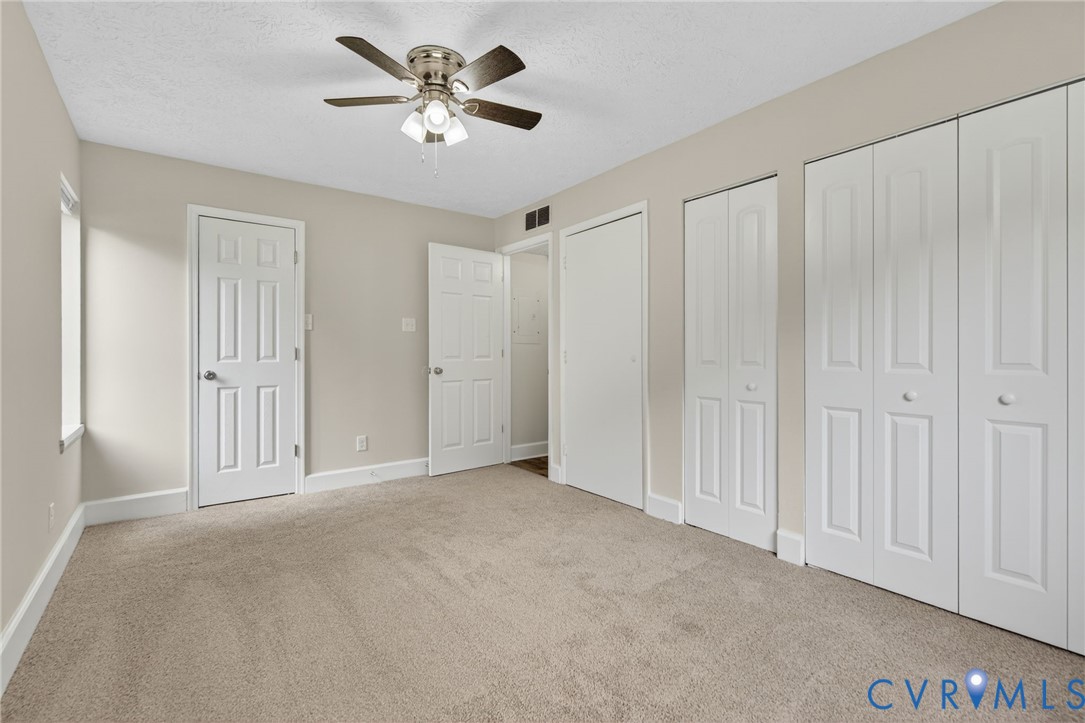 1501 Bronwyn Road, Unit 101 Henrico, VA 23238 - Photo 18 of 24 a view of a livingroom with a chandelier fan