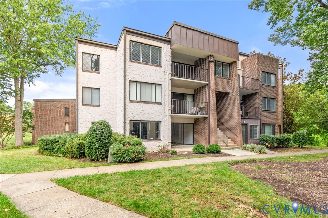 1501 Bronwyn Road, Unit 101 Henrico, VA 23238 - Photo 2 of 24 a view of a building with a yard