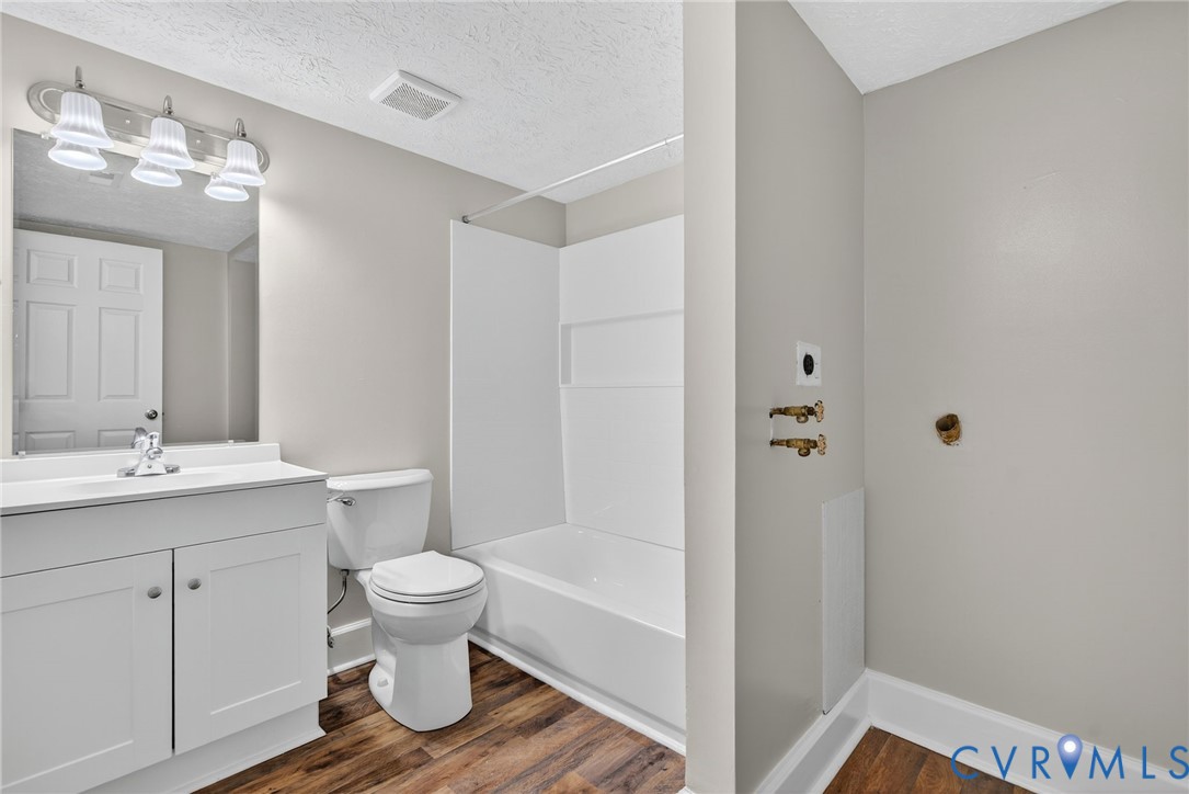 1501 Bronwyn Road, Unit 101 Henrico, VA 23238 - Photo 21 of 24 a bathroom with a sink a toilet and shower