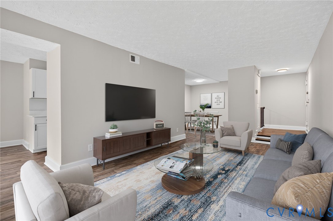 1501 Bronwyn Road, Unit 101 Henrico, VA 23238 - Photo 6 of 24 a living room with furniture and a flat screen tv