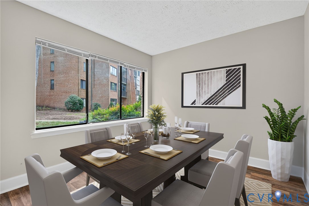 1501 Bronwyn Road, Unit 101 Henrico, VA 23238 - Photo 7 of 24 a dining room with furniture a large window and a wooden floor