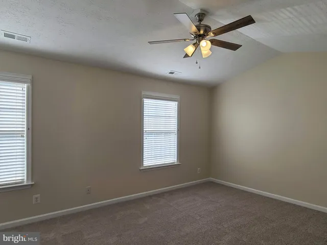 a bathroom with a tub shower sink and a toilet