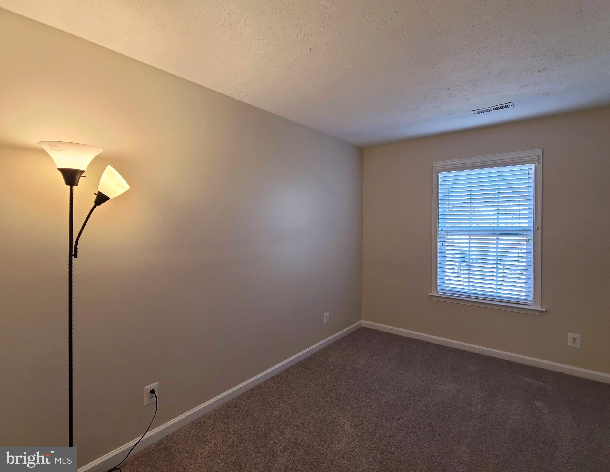 106 Regina Lane Fredericksburg, VA 22405 - Photo 22 of 31 a view of an empty room with a window