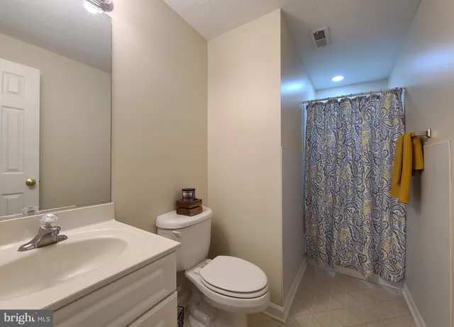 an empty room with a fan