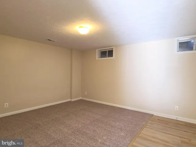 an empty room with closet area