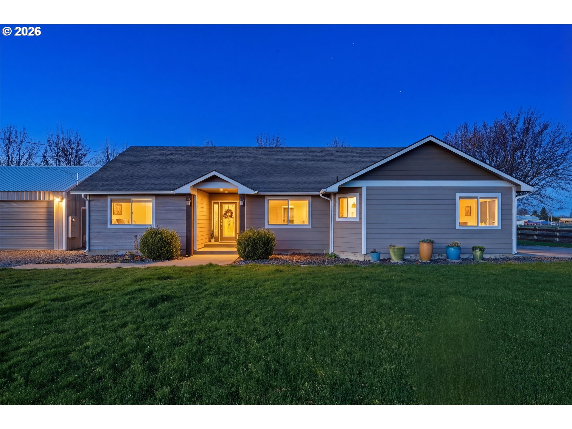 84780 Tum-A-Lum Road Milton Freewater, OR 97862 - Photo 3 of 48 a front view of a house with a yard