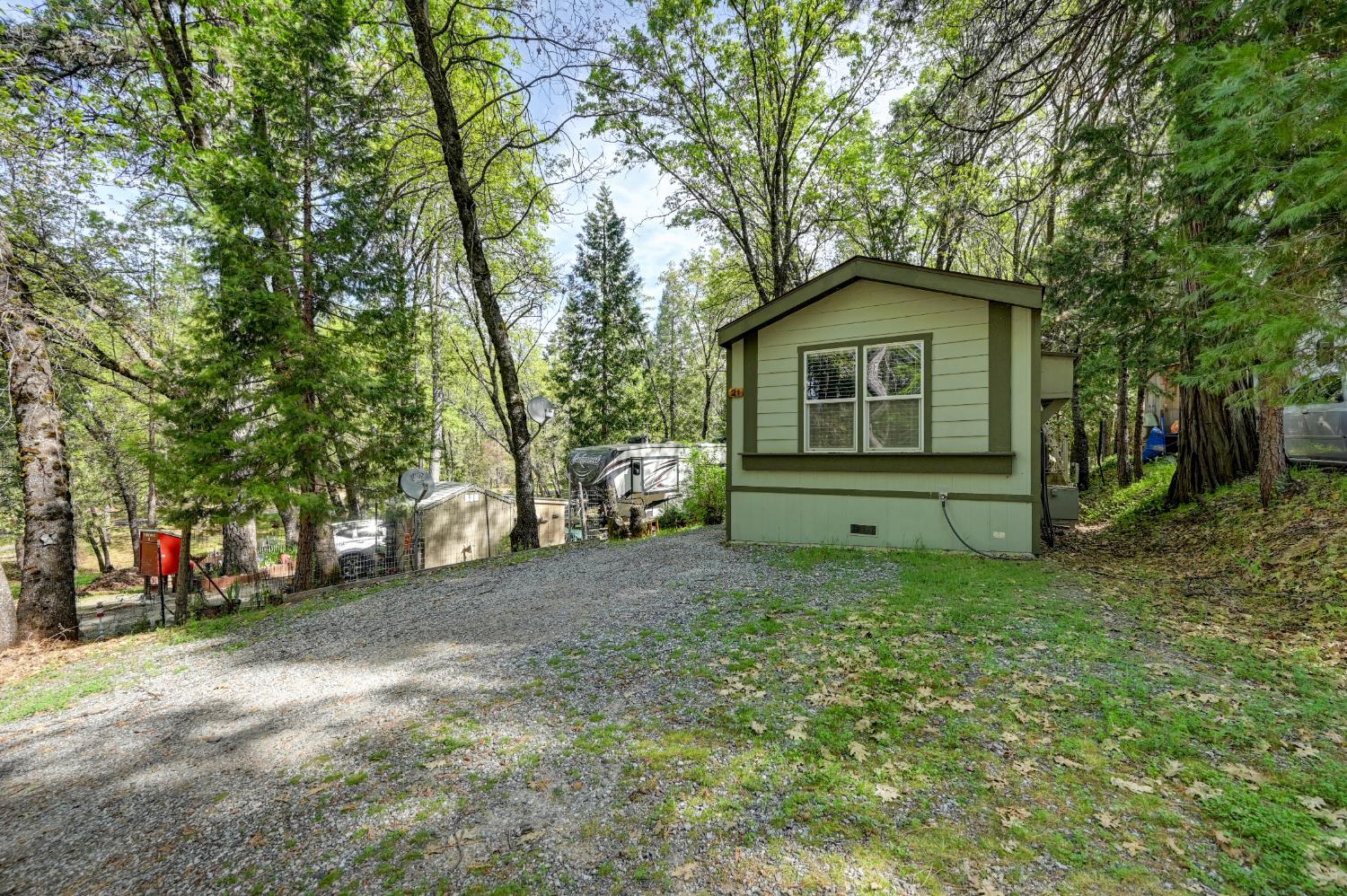 245 Railroad Flat Road Rail Road Flat, CA 95248 - Photo 12 of 20 a yellow house with trees in front of it