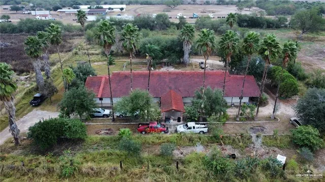 an aerial view of a house with an outdoor space
