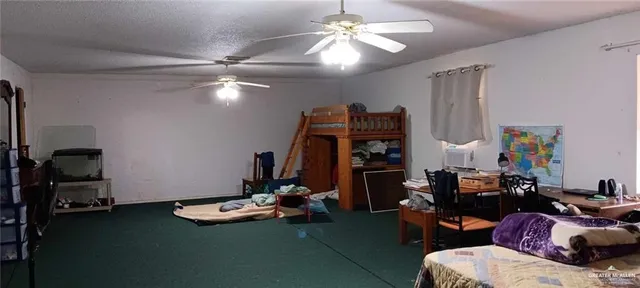 a room with a sink and a mirror