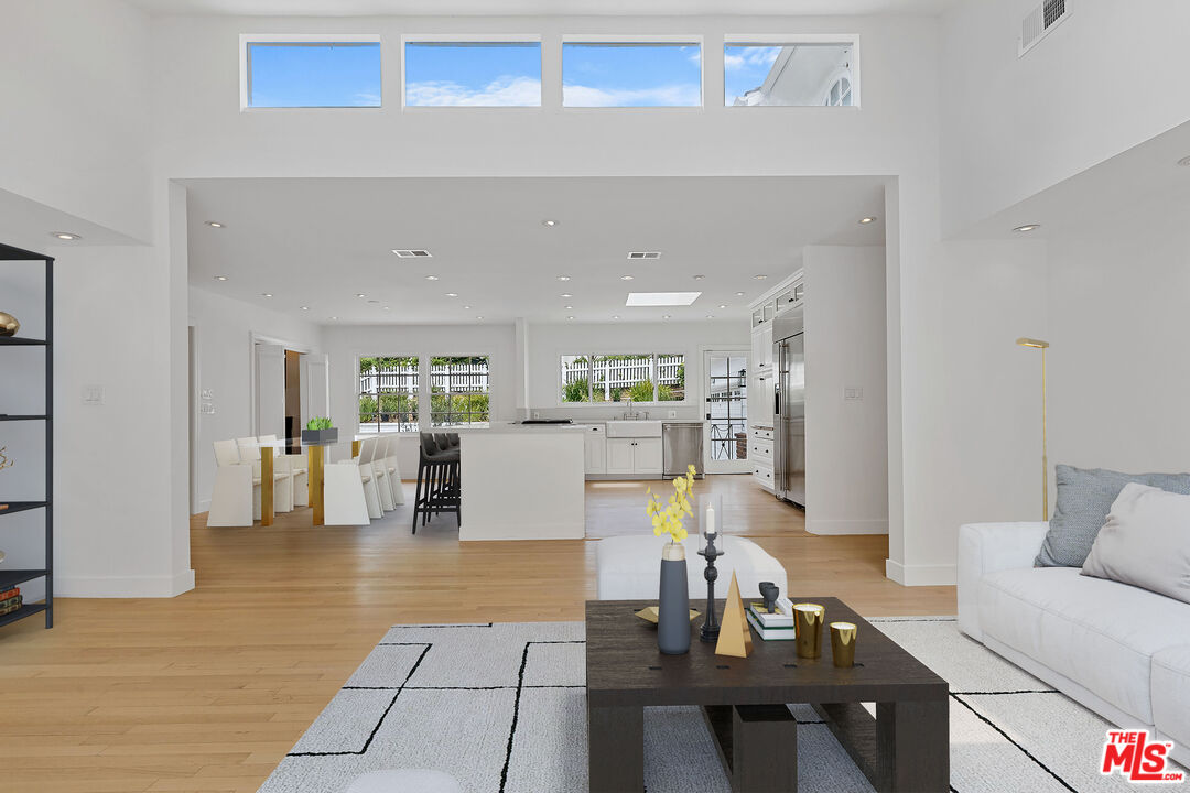1462 Rising Glen Road Los Angeles, CA 90069 - Photo 11 of 39 a living room with furniture and a table