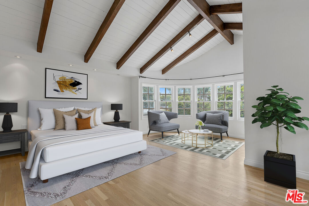 1462 Rising Glen Road Los Angeles, CA 90069 - Photo 19 of 39 a bedroom with furniture and a large window