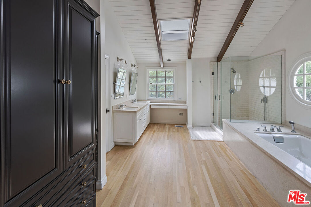 1462 Rising Glen Road Los Angeles, CA 90069 - Photo 29 of 39 a bathroom with a sink a toilet and shower