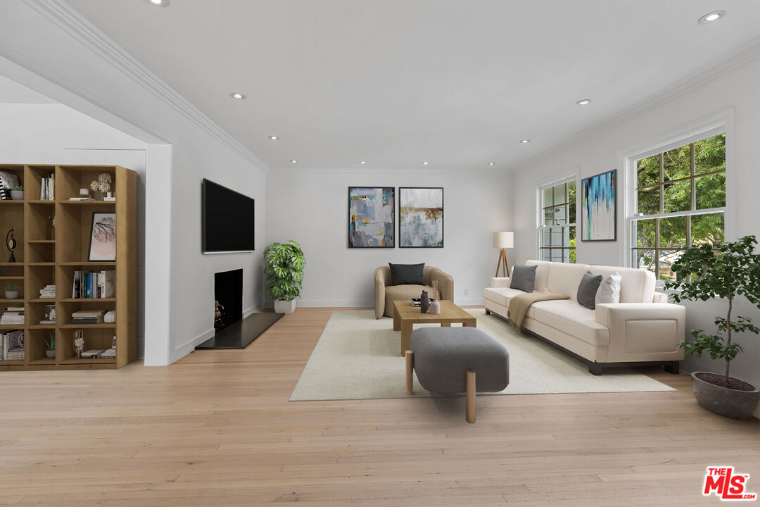 1462 Rising Glen Road Los Angeles, CA 90069 - Photo 3 of 39 a living room with furniture and a flat screen tv