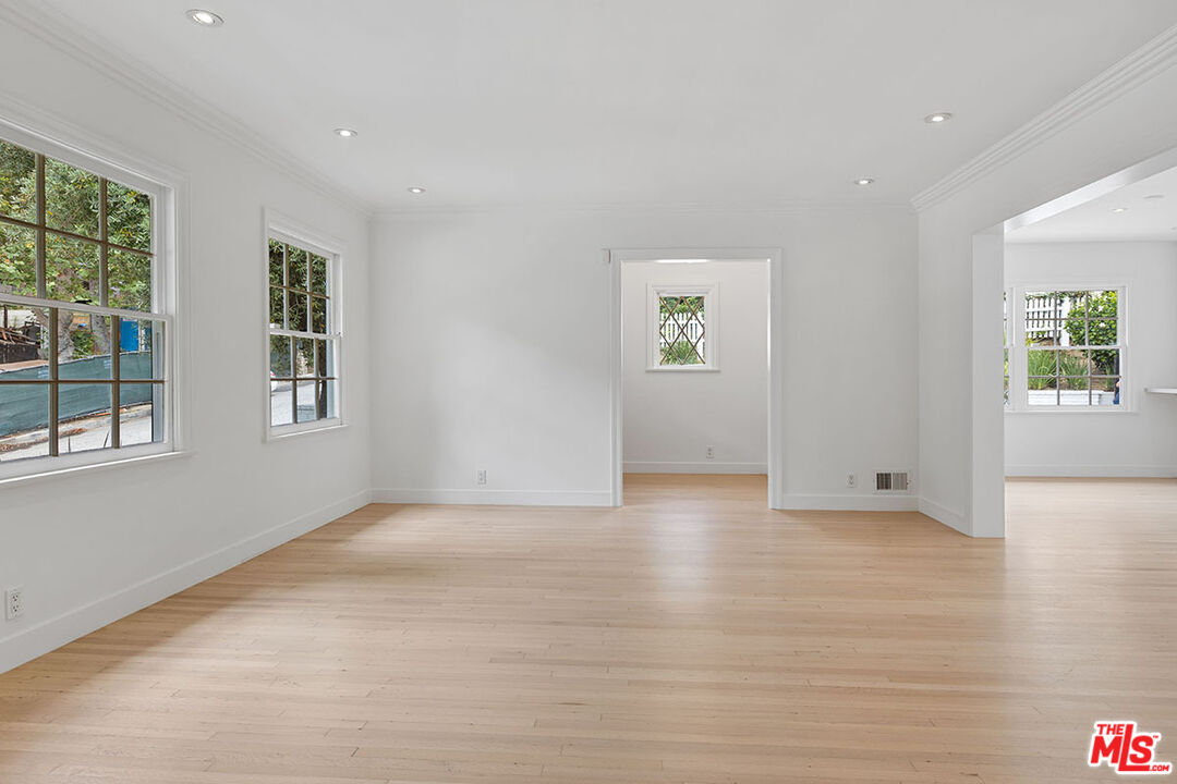 1462 Rising Glen Road Los Angeles, CA 90069 - Photo 8 of 39 a view of an empty room with a window