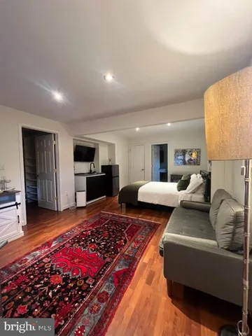 a living room with furniture and a rug