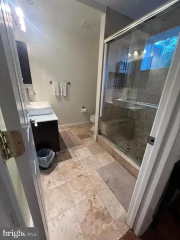 a bathroom with a sink and mirror