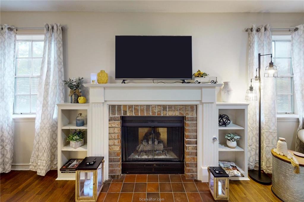 900 Westview Street Bryan, TX 77802 - Photo 5 of 30 a living room with furniture and a fireplace