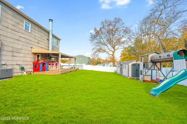 a childrens park with lots of swings and slides