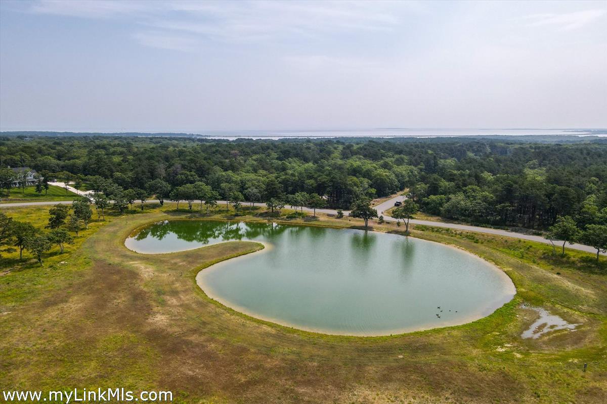 22 Paddock Road Oak Bluffs, MA 02557 - Photo 6 of 6 a view of a swimming pool with a yard
