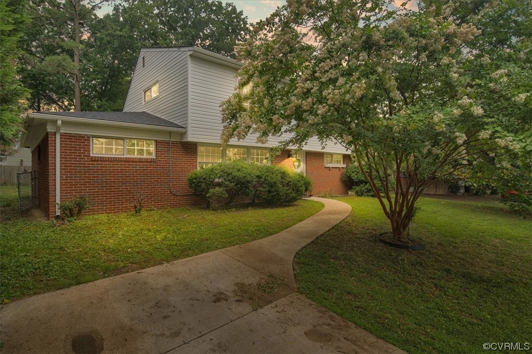 9419 Camrose Road Henrico, VA 23229 - Photo 1 of 29 a view of a house with a yard