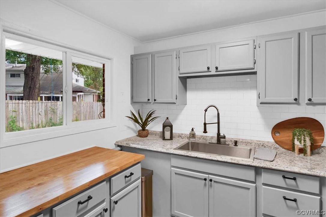 9419 Camrose Road Henrico, VA 23229 - Photo 12 of 29 a kitchen with granite countertop a sink a stove and cabinets