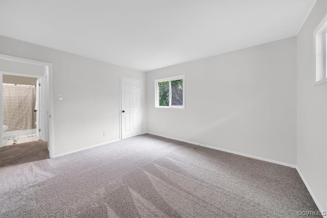 9419 Camrose Road Henrico, VA 23229 - Photo 16 of 29 a view of an empty room with wooden floor and a window