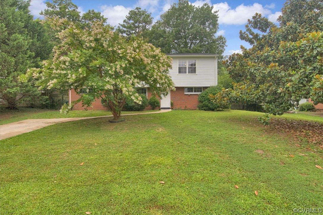 9419 Camrose Road Henrico, VA 23229 - Photo 2 of 29 a view of a yard with a house in the background