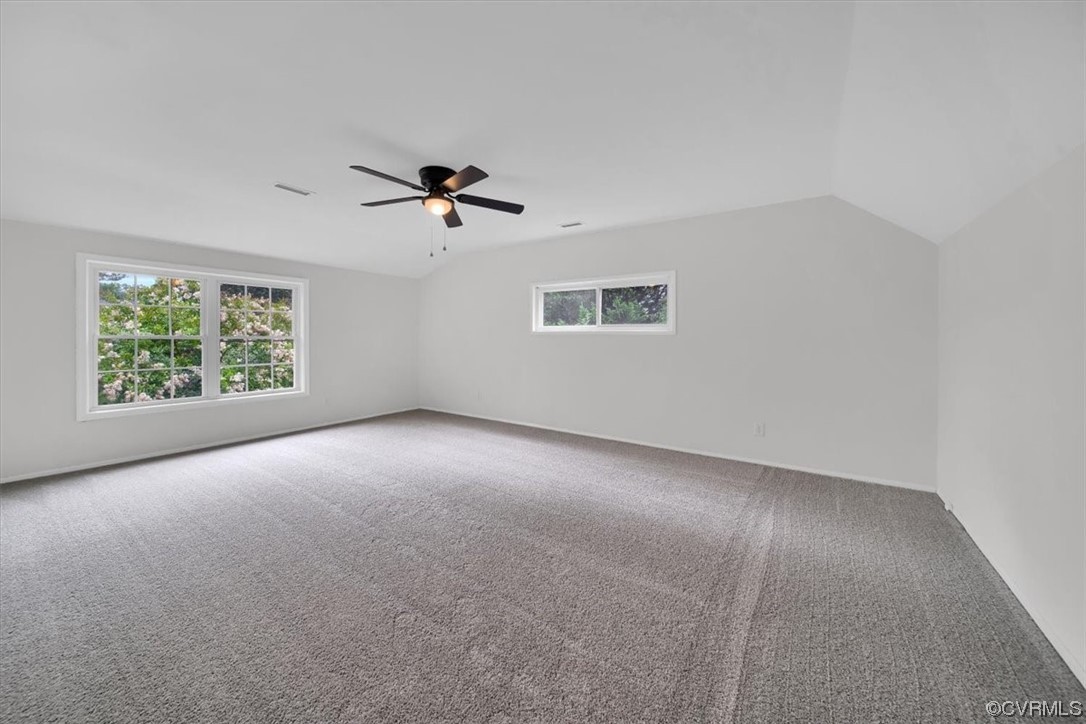 9419 Camrose Road Henrico, VA 23229 - Photo 23 of 29 an empty room with windows and chandelier fan
