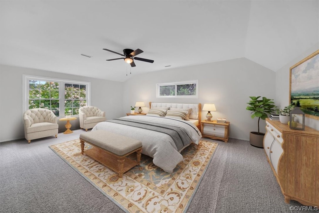 9419 Camrose Road Henrico, VA 23229 - Photo 26 of 29 a spacious bedroom with a bed a couch and a potted plant